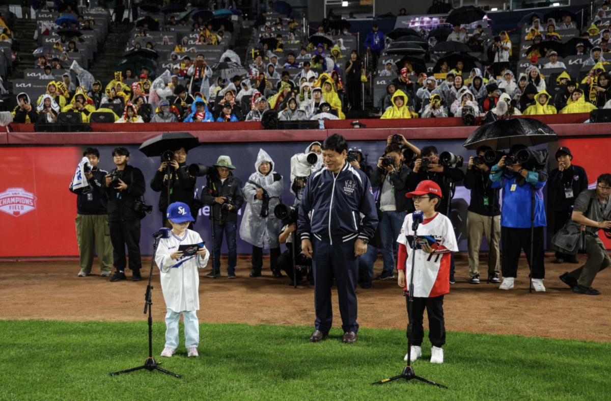 Both excited and nervous, Aileen steps on the baseball field and announces the opening of the first game of the Korean Series. Her confident voice resounds through the stadium. Photo courtesy of the Kim family.